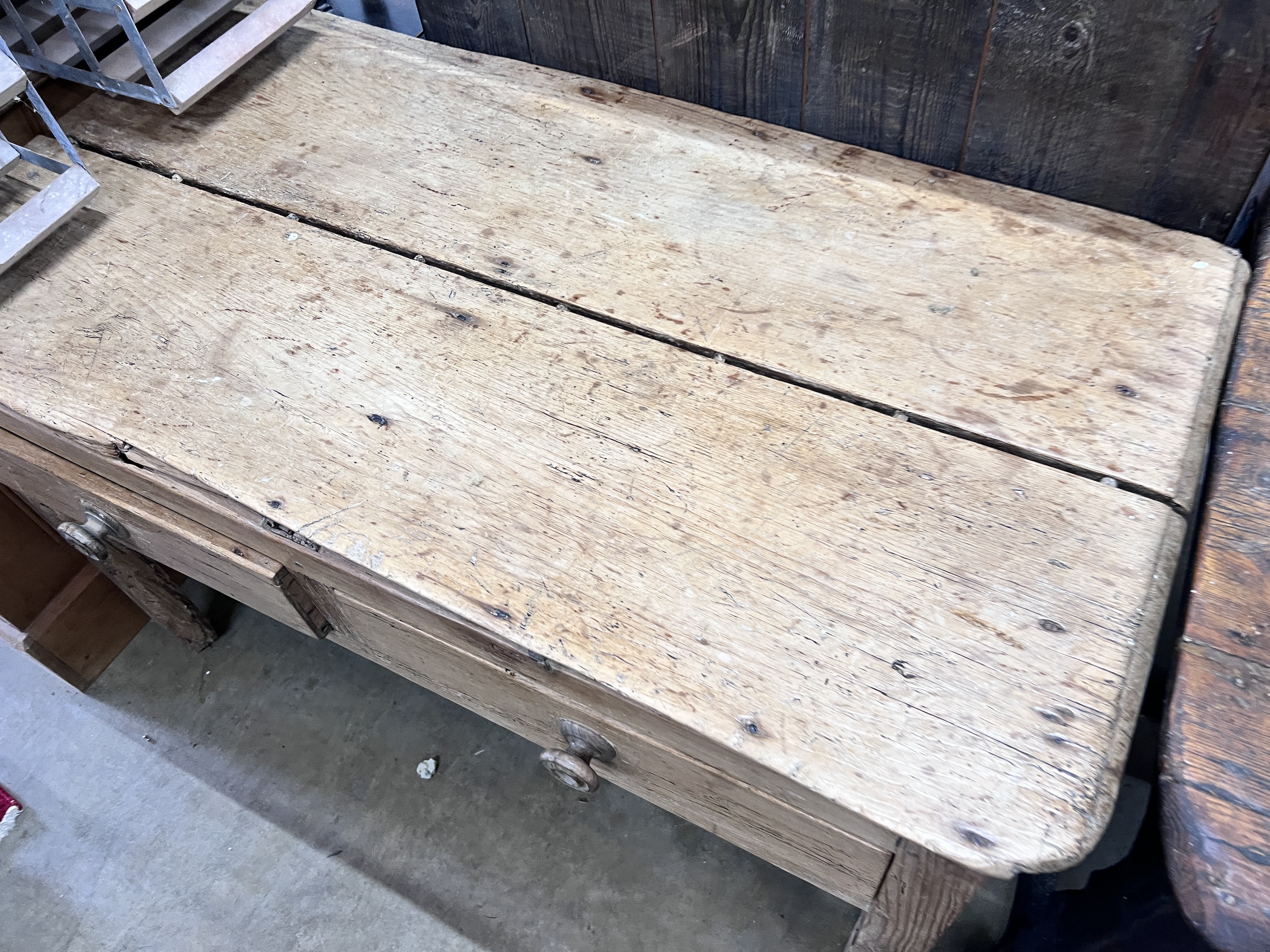 A 19th century pine two drawer table, width 118cm, depth 59cm, height 73cm